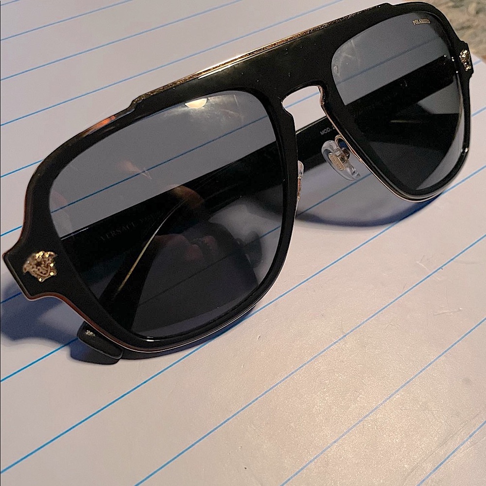 Versace Ve2199 Black an gold With Versace symbols on both ends of frame .
